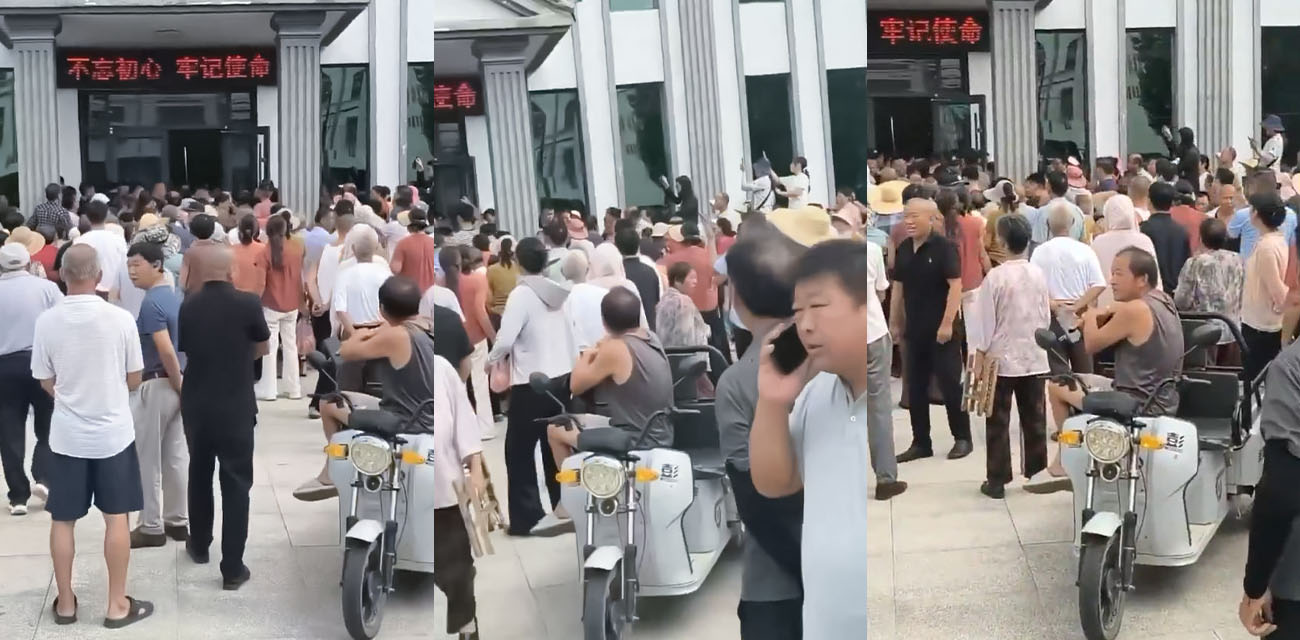 河南信阳余店村 裕丰粮业维权事件 大量村民聚集党群服务中心讨说法 厂区大门前花圈一字排开